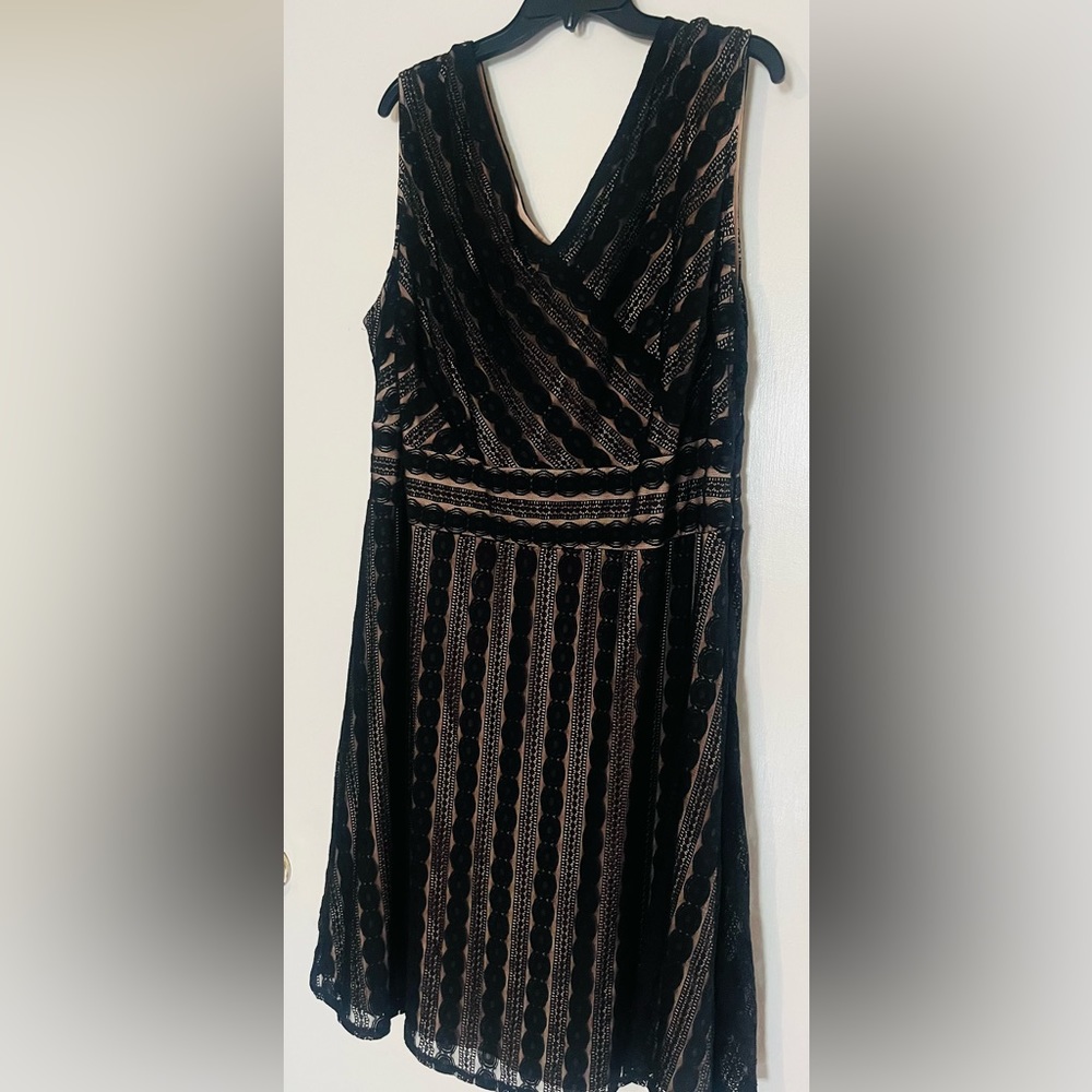 Signature Harper 22W black and nude lace empire waist dress.